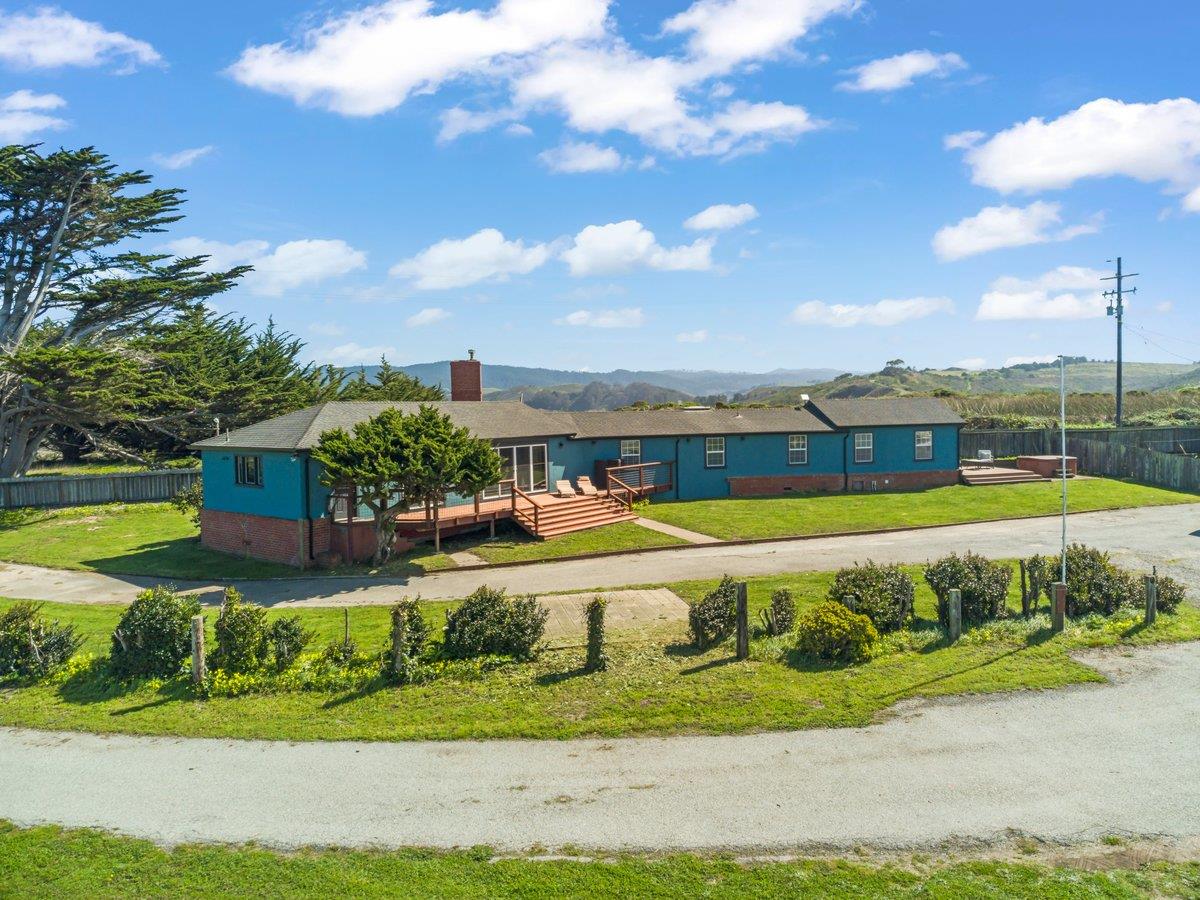 1263 Reservoir Road Pescadero, CA 94060 - Photo 16 of 75 a view of a swimming pool with a yard