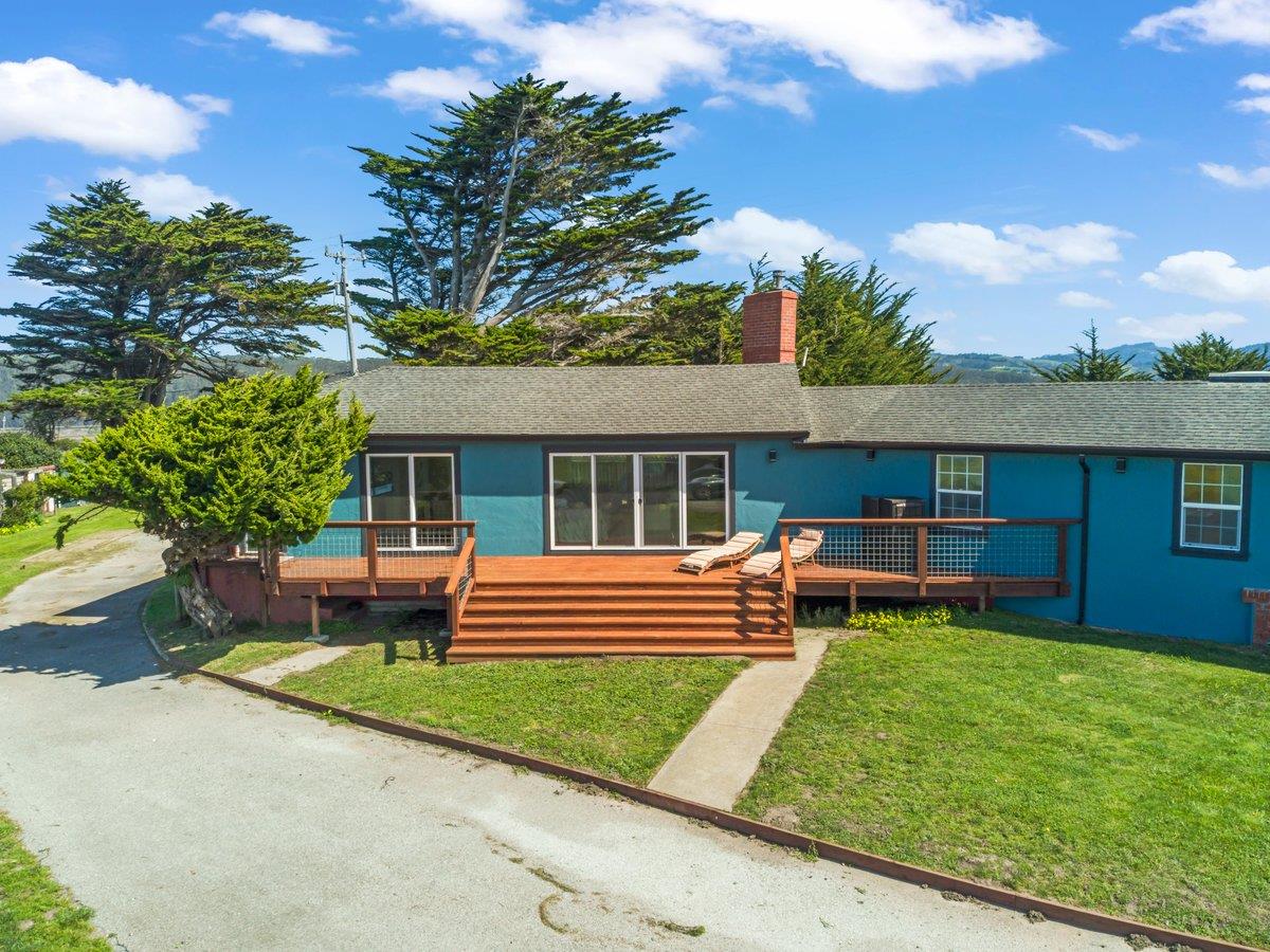 1263 Reservoir Road Pescadero, CA 94060 - Photo 18 of 75 a front view of a house with a yard table and chairs