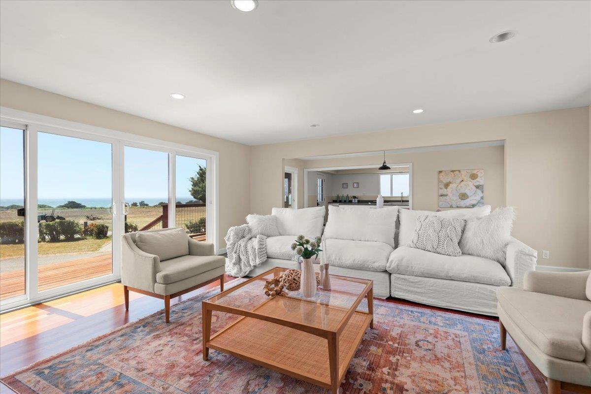 1263 Reservoir Road Pescadero, CA 94060 - Photo 30 of 75 a living room with furniture and a floor to ceiling window