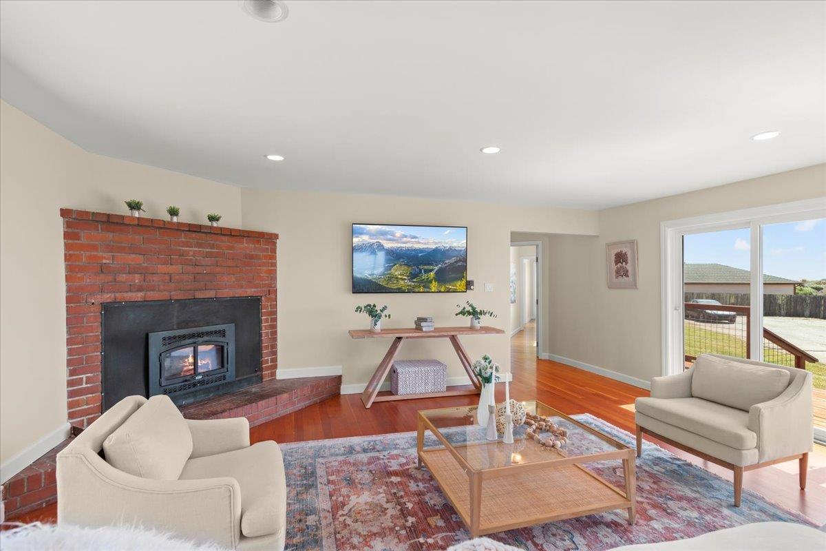 1263 Reservoir Road Pescadero, CA 94060 - Photo 33 of 75 a living room with furniture and a fireplace