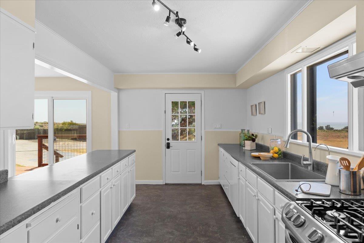 1263 Reservoir Road Pescadero, CA 94060 - Photo 40 of 75 a kitchen with sink stove and cabinets