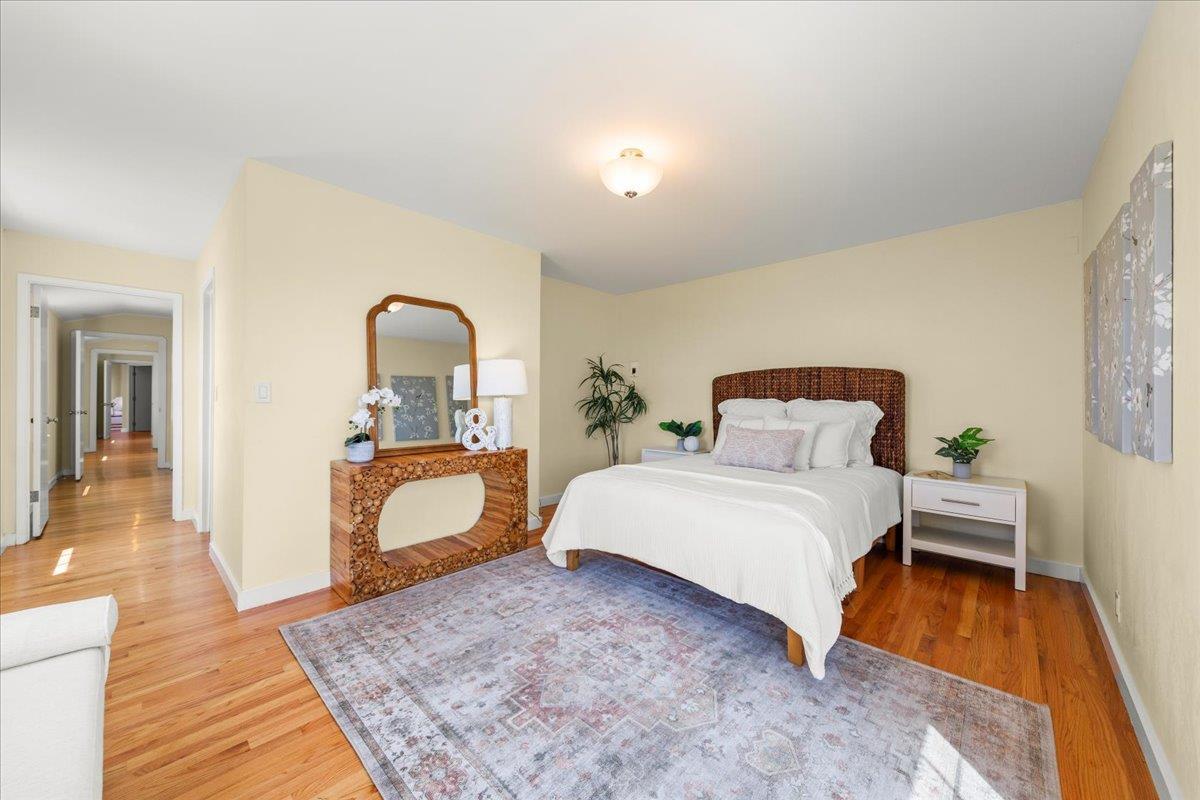 1263 Reservoir Road Pescadero, CA 94060 - Photo 41 of 75 a bedroom with a bed and a dresser with mirror