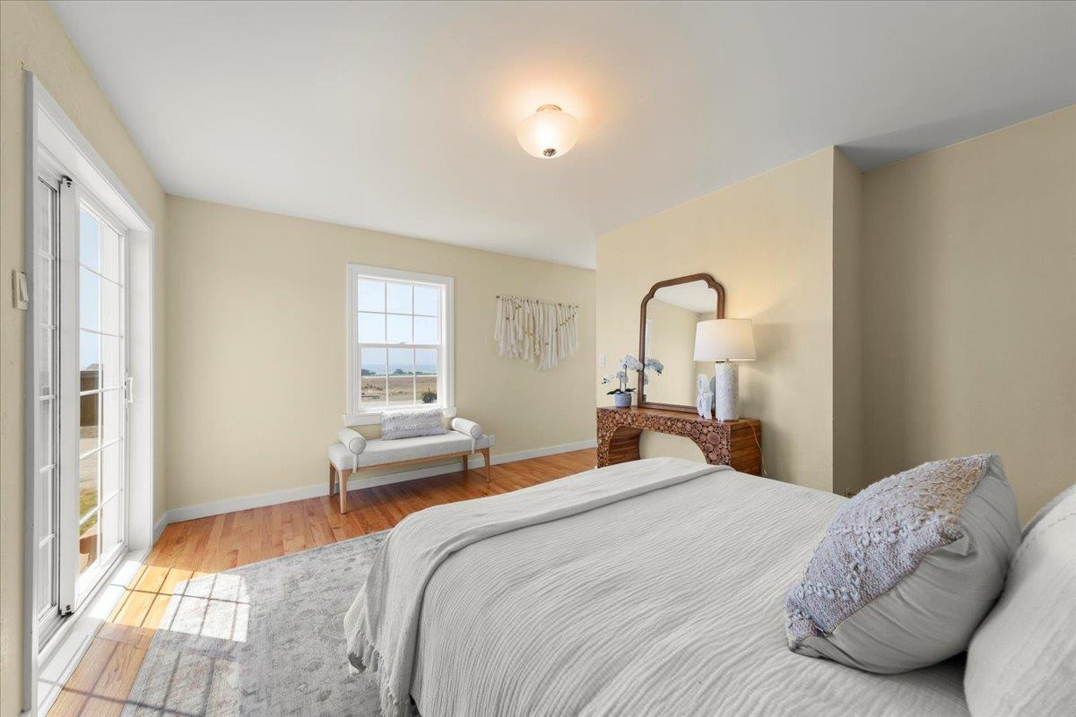 1263 Reservoir Road Pescadero, CA 94060 - Photo 42 of 75 a bedroom with a bed and a mirror