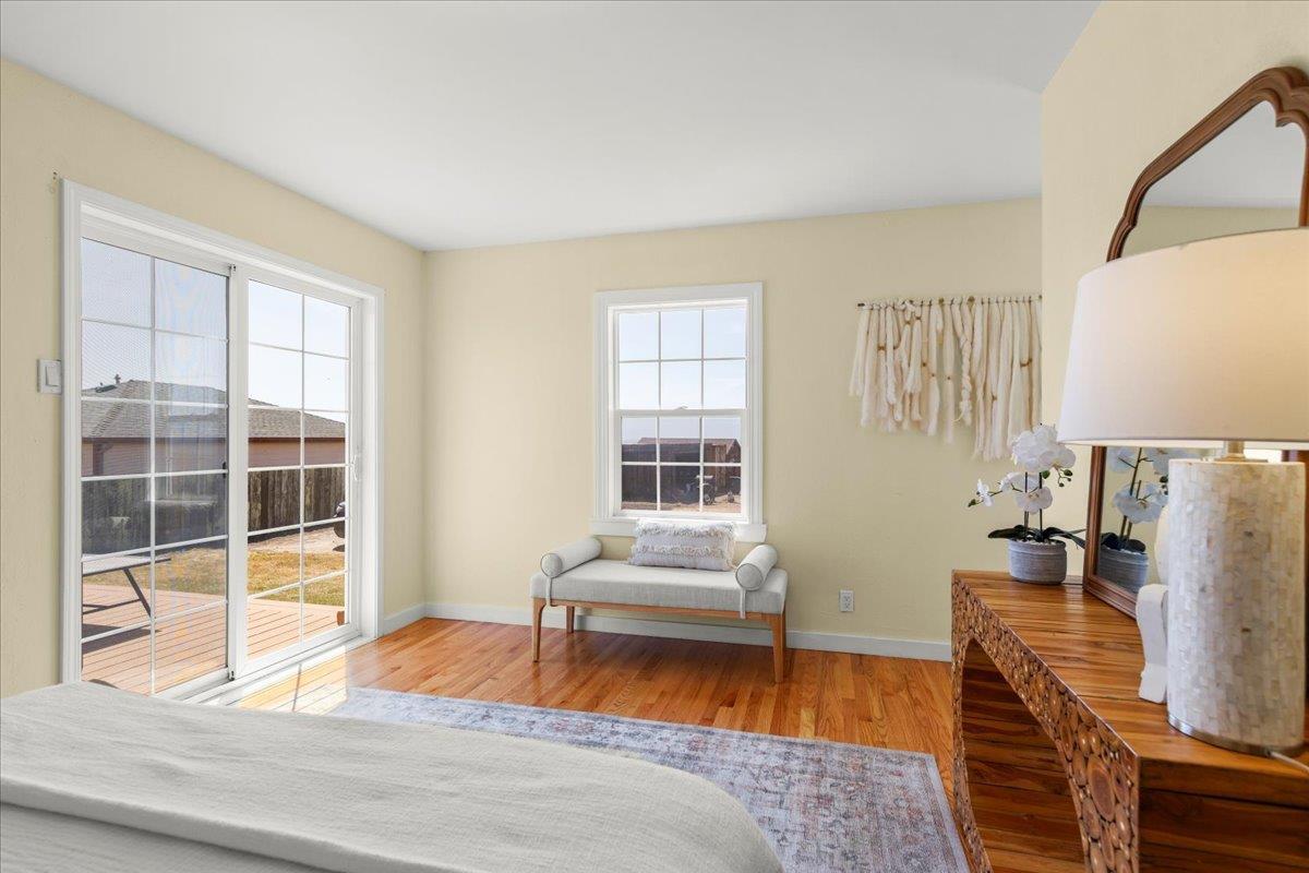 1263 Reservoir Road Pescadero, CA 94060 - Photo 44 of 75 a bedroom with a bed and wooden floor