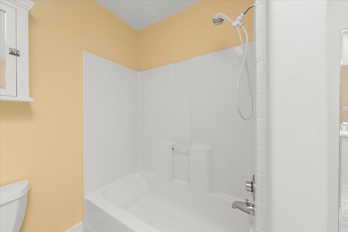 1263 Reservoir Road Pescadero, CA 94060 - Photo 50 of 75 a bathroom with a white bath tub