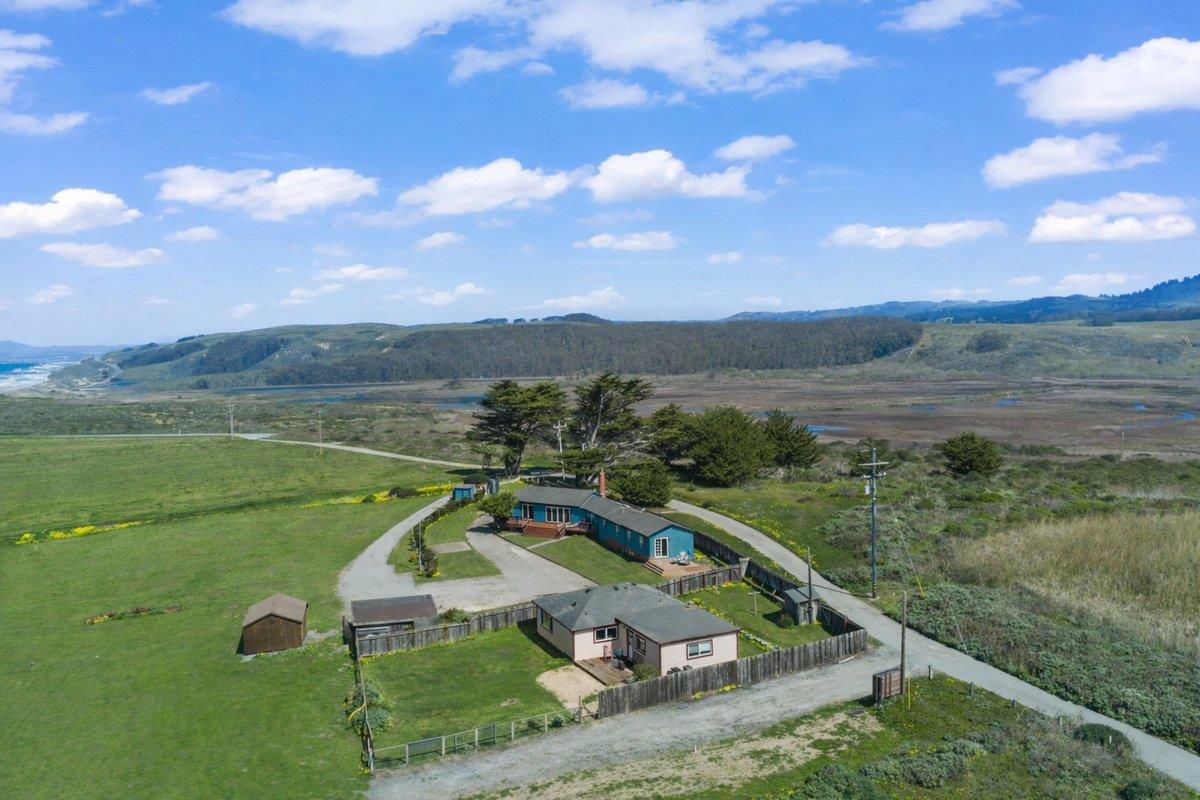 1263 Reservoir Road Pescadero, CA 94060 - Photo 5 of 75 a view of a lake in front of the house