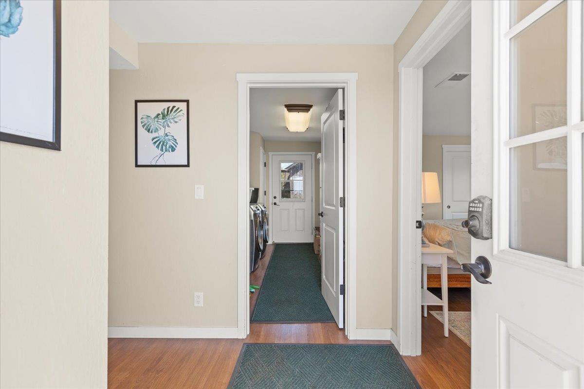 1263 Reservoir Road Pescadero, CA 94060 - Photo 59 of 75 a view of a hallway with wooden floor and a living room