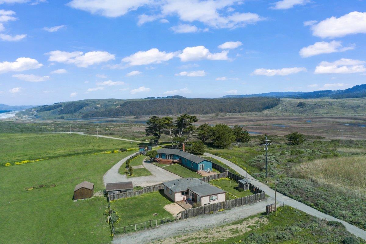 1263 Reservoir Road Pescadero, CA 94060 - Photo 6 of 75 a view of a lake with a mountain in the background