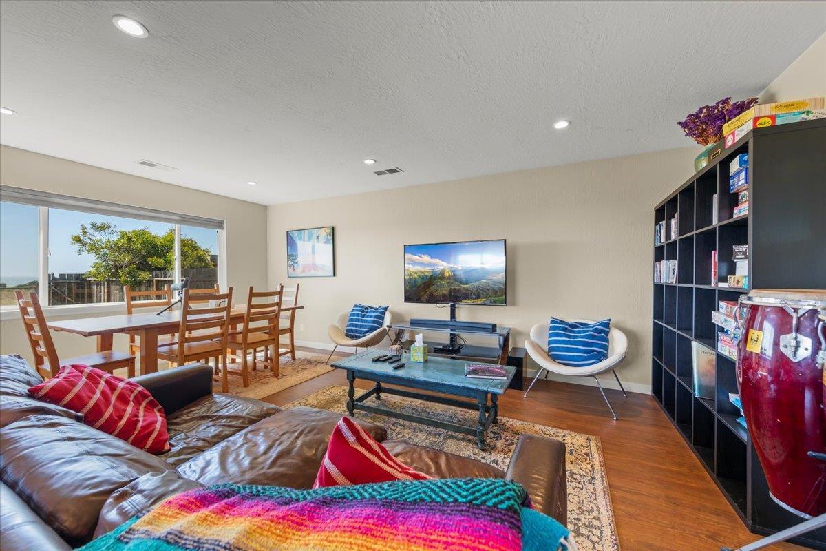 1263 Reservoir Road Pescadero, CA 94060 - Photo 64 of 75 a living room with furniture and a flat screen tv