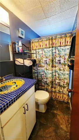 a bedroom with a bed and utility room