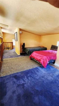 a bathroom with a blue sink and a mirror