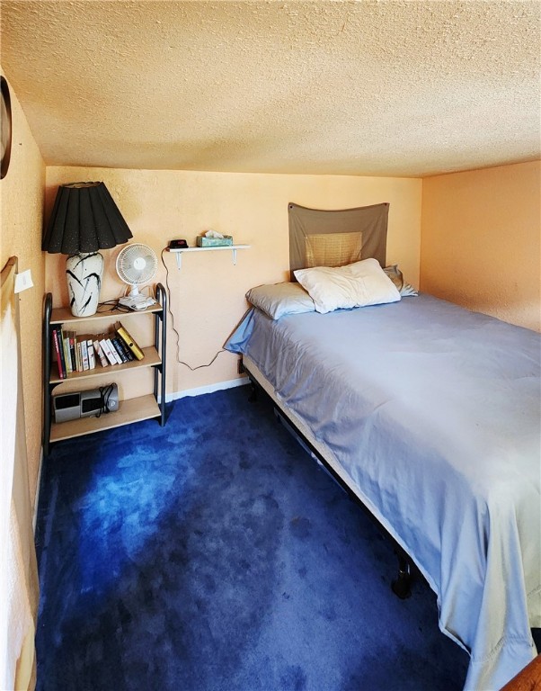 24901 County Road 350 Mathis, TX 78368 - Photo 14 of 20 a bedroom with a bed and wooden floor