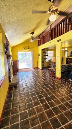 a view of a lobby with wooden floor and windows