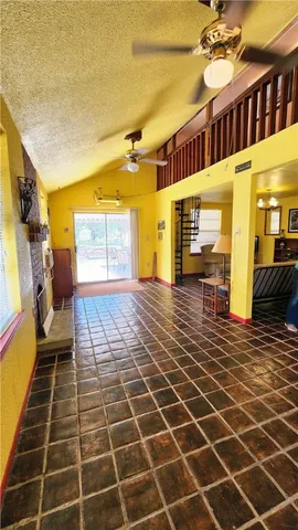 a view of a lobby with wooden floor and windows