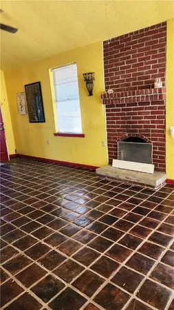 a view of a livingroom with a hall and wooden floor