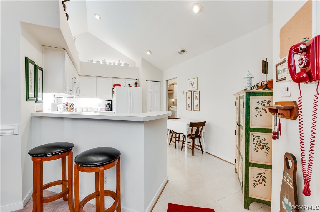 1329 Tannery Circle Midlothian, VA 23113 - Photo 18 of 35 a kitchen with stainless steel appliances kitchen island a table chairs stove and cabinets