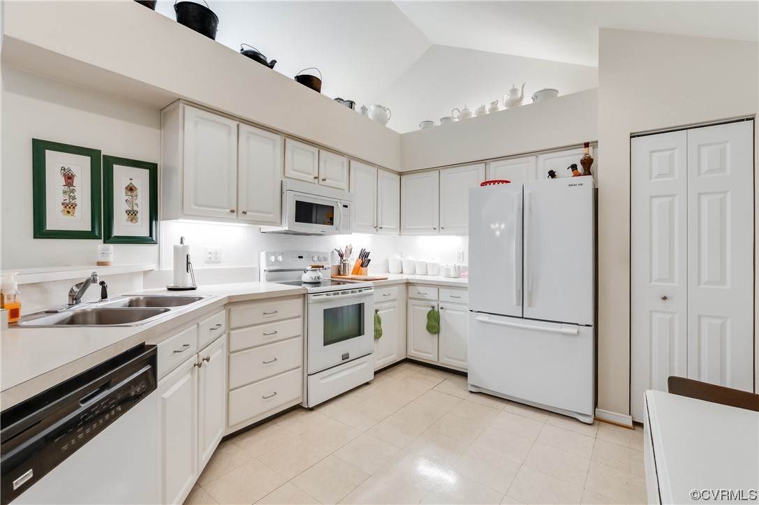 1329 Tannery Circle Midlothian, VA 23113 - Photo 19 of 35 a kitchen with white cabinets and white appliances