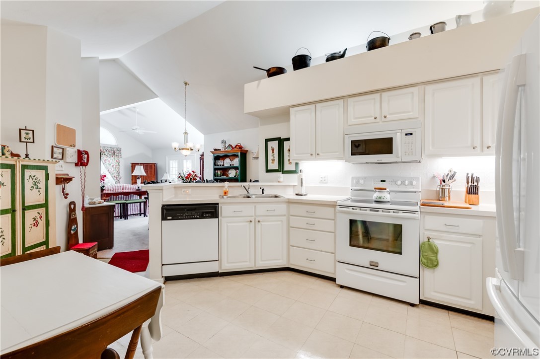 1329 Tannery Circle Midlothian, VA 23113 - Photo 20 of 35 a kitchen with cabinets and white appliances