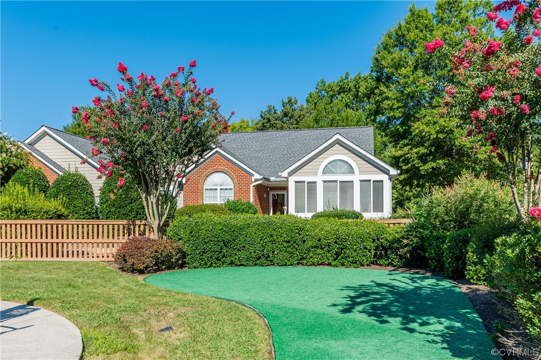 1329 Tannery Circle Midlothian, VA 23113 - Photo 2 of 35 a front view of a house with a yard and garage