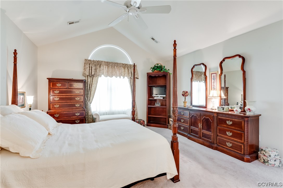 1329 Tannery Circle Midlothian, VA 23113 - Photo 24 of 35 a bedroom with a bed a dresser and large mirror