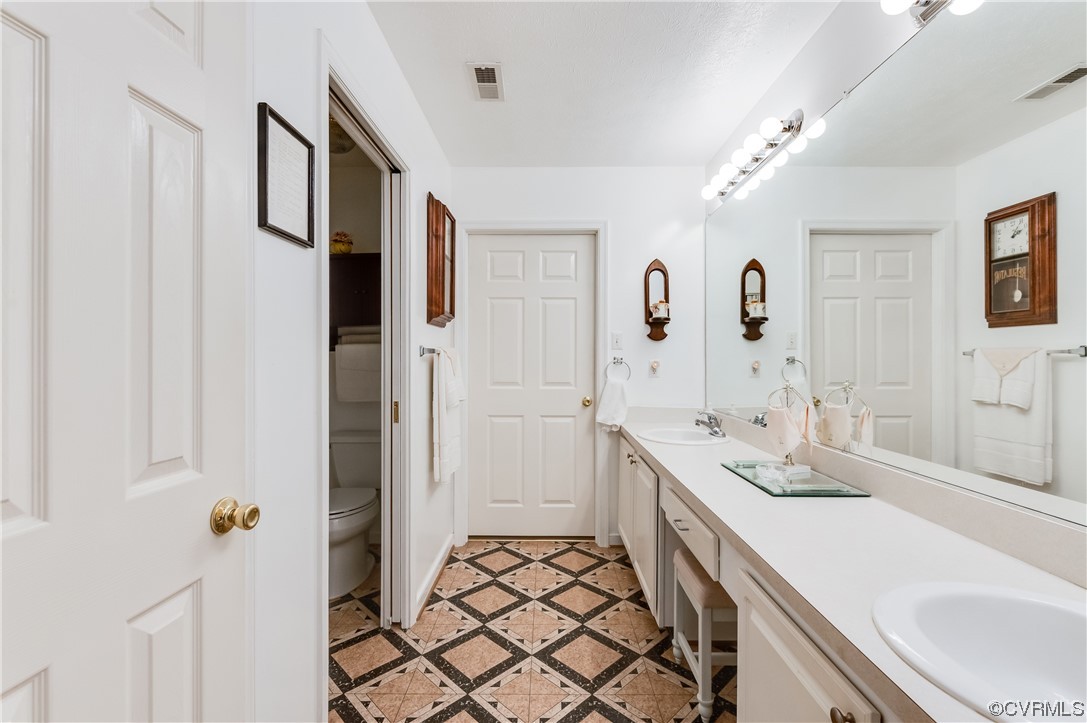 1329 Tannery Circle Midlothian, VA 23113 - Photo 26 of 35 a spacious bathroom with a double vanity sink mirror and double