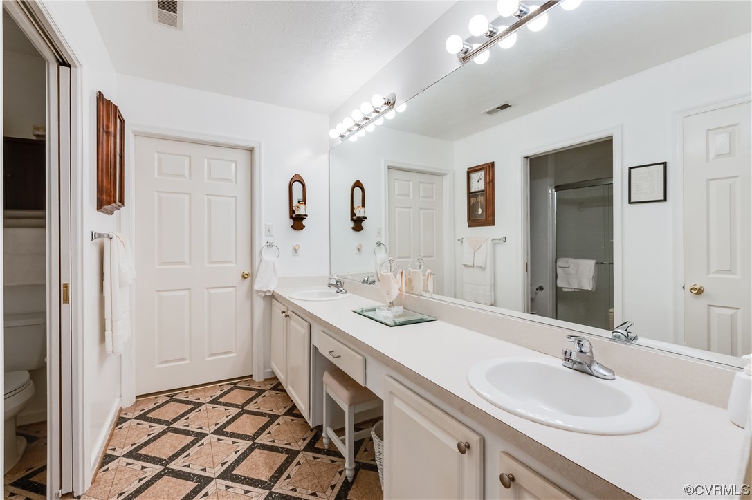 1329 Tannery Circle Midlothian, VA 23113 - Photo 27 of 35 a spacious bathroom with a sink double vanity and a mirror