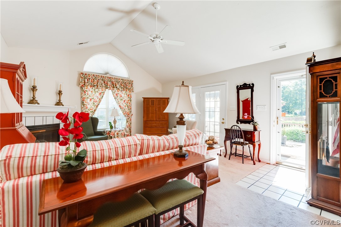 1329 Tannery Circle Midlothian, VA 23113 - Photo 7 of 35 a living room with furniture a rug and a chandelier