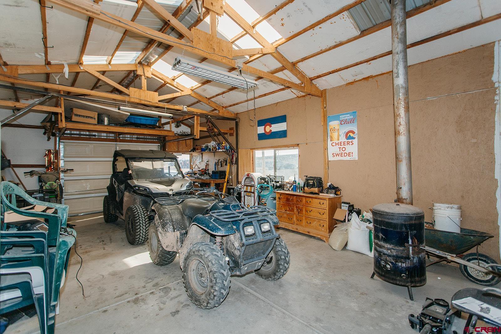 5697 Peach Valley Road Delta, CO 81416 - Photo 17 of 31 a room with lots of wooden furniture and a window