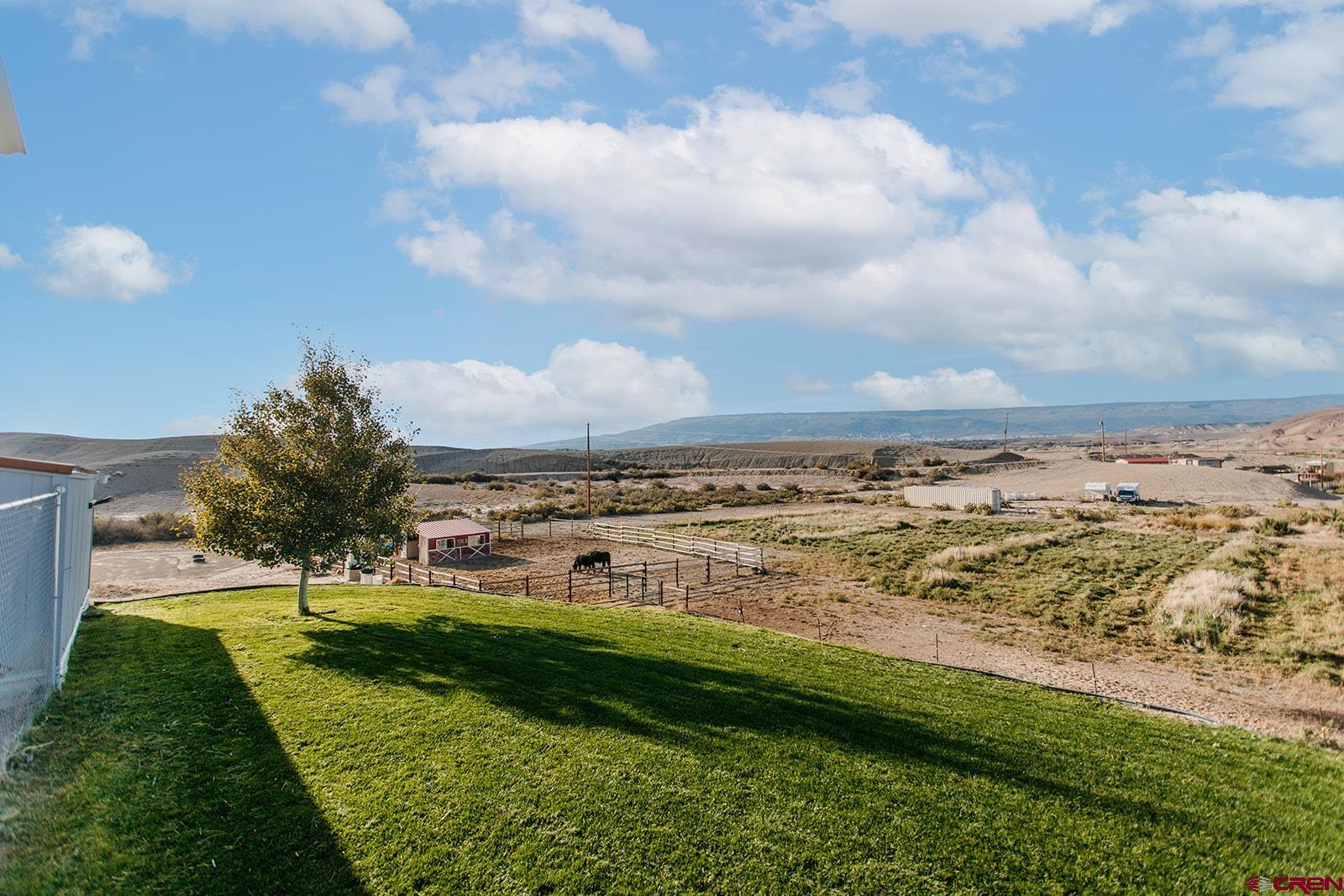 5697 Peach Valley Road Delta, CO 81416 - Photo 29 of 31 a view of a field with an ocean