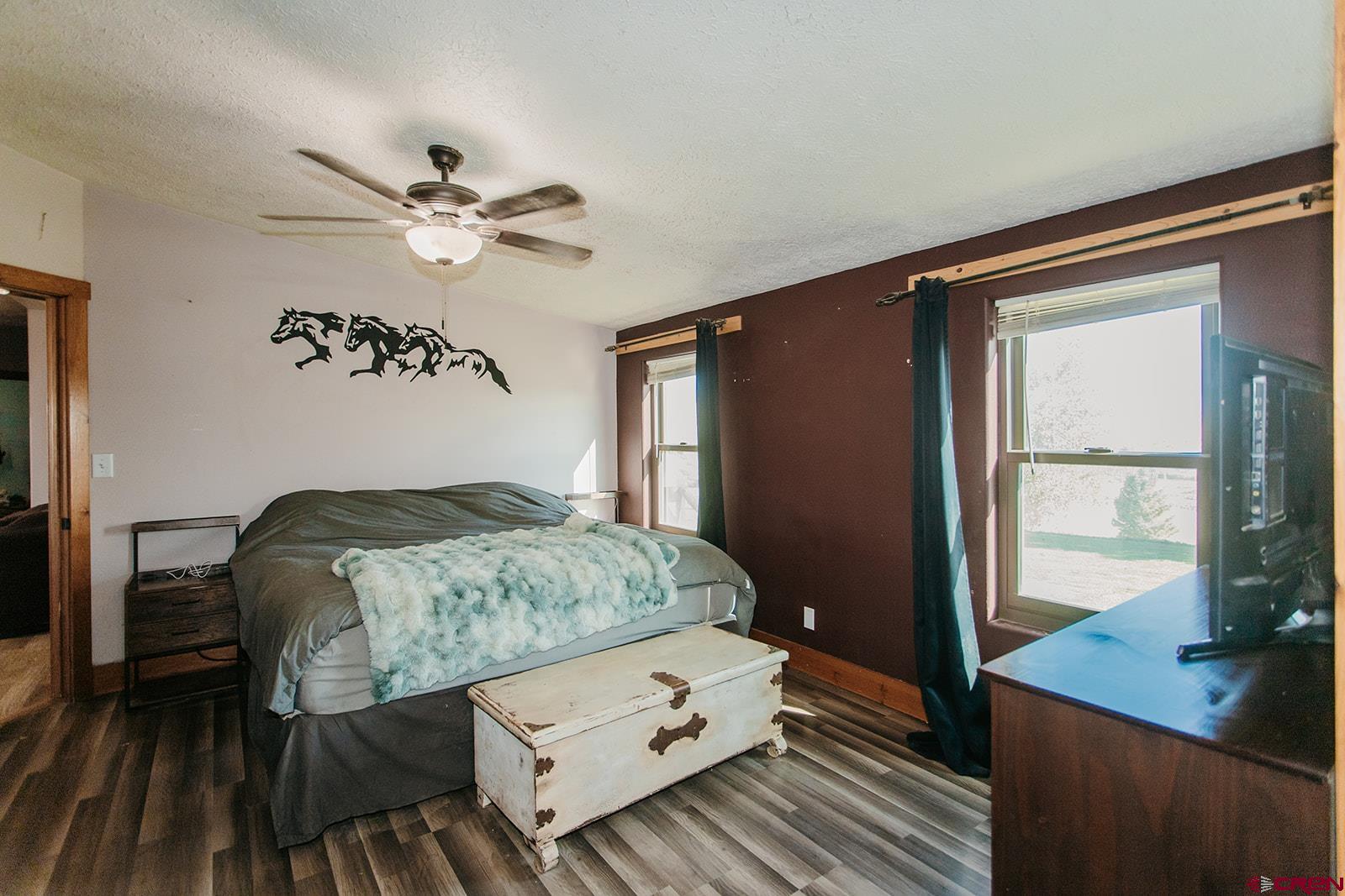 5697 Peach Valley Road Delta, CO 81416 - Photo 4 of 31 a bedroom with a bed and a table