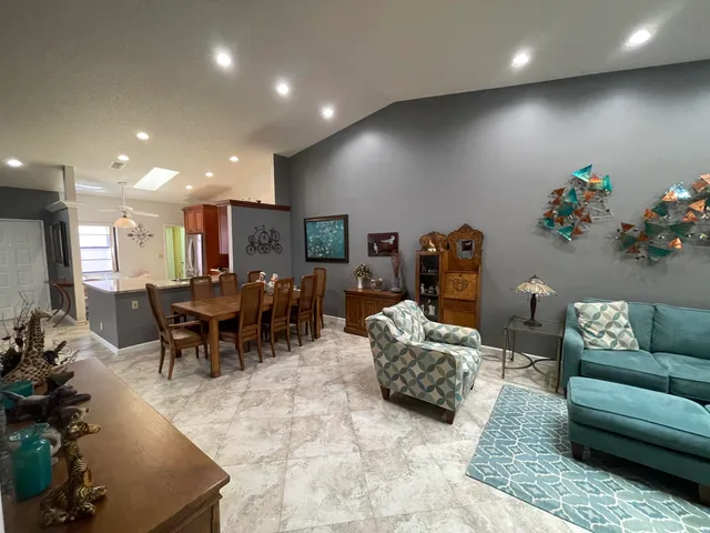 a living room with furniture and a table