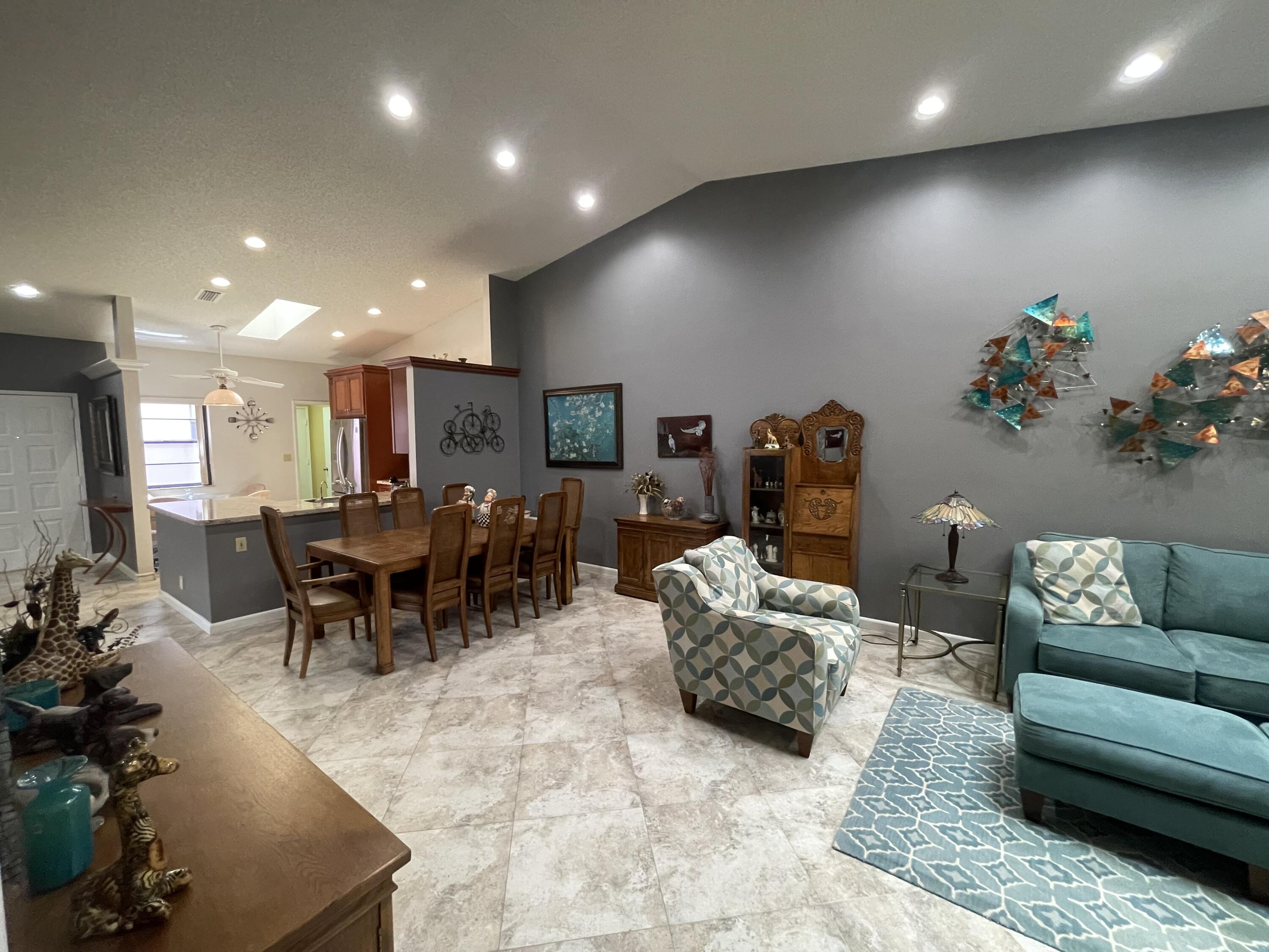 6141 Sunny Pointe Circle, Unit B Delray Beach, FL 33484 - Photo 13 of 62 a living room with furniture and a table