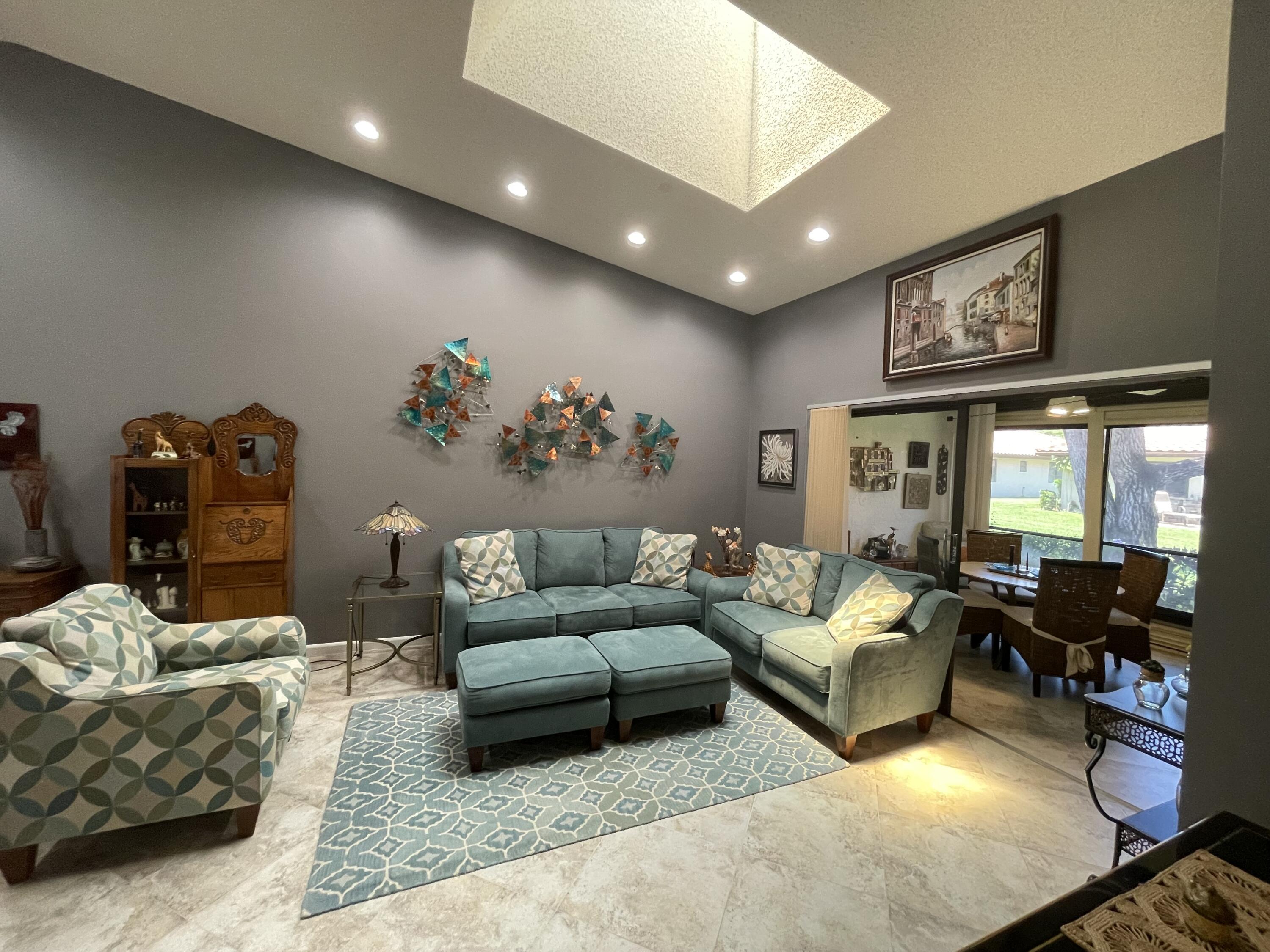 6141 Sunny Pointe Circle, Unit B Delray Beach, FL 33484 - Photo 14 of 62 a living room with furniture and wooden floor