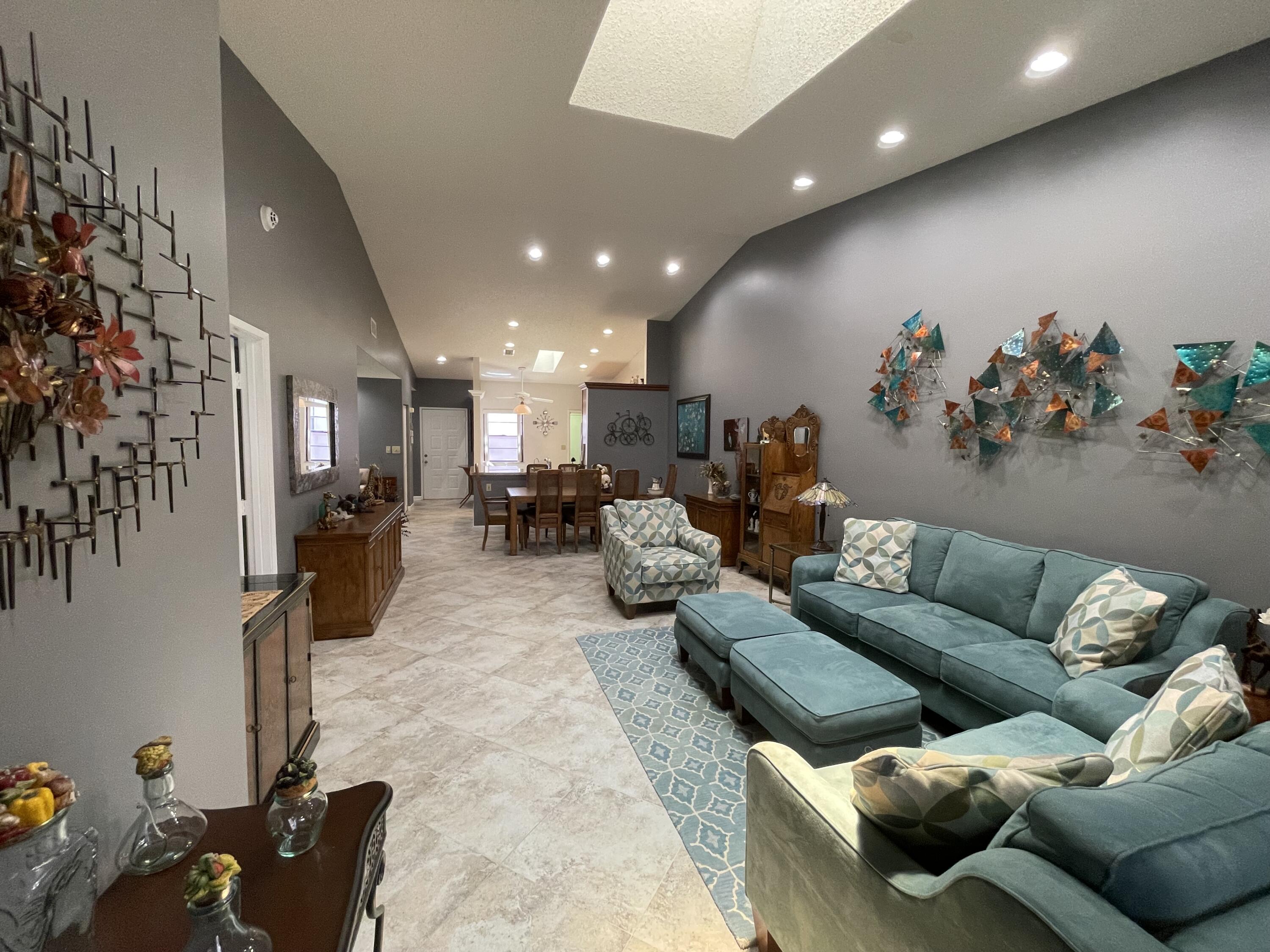 6141 Sunny Pointe Circle, Unit B Delray Beach, FL 33484 - Photo 16 of 62 a living room with furniture and a couch