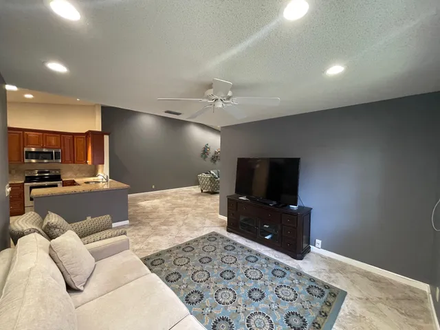 a bathroom with a double vanity sink a mirror and a bathtub