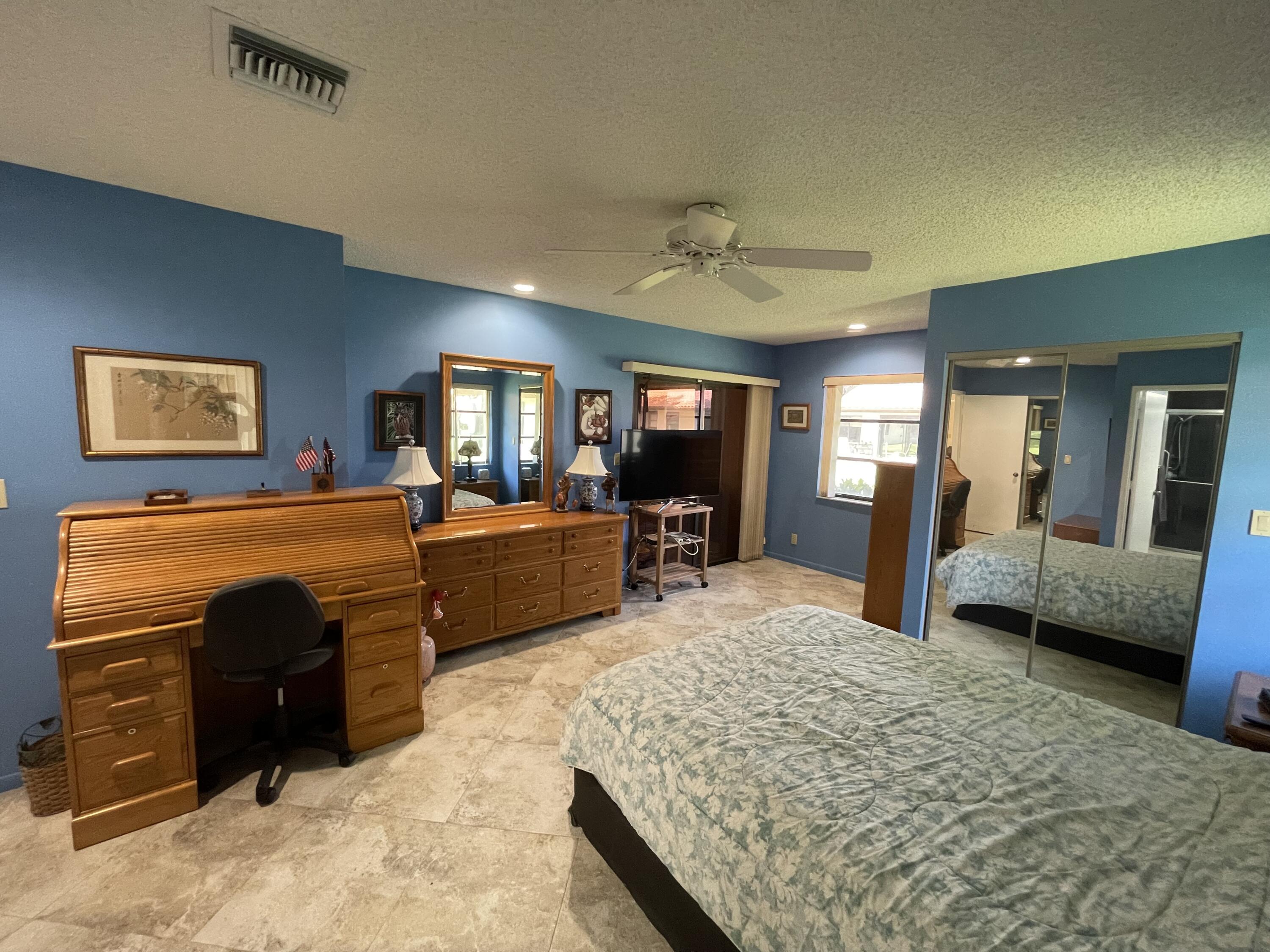 6141 Sunny Pointe Circle, Unit B Delray Beach, FL 33484 - Photo 23 of 62 Primary Bedroom from Bath door