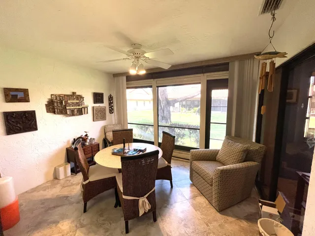 a room with lots of furniture and a chandelier