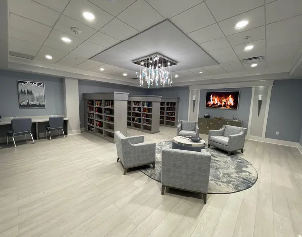 a very nice looking room with a large window and couch