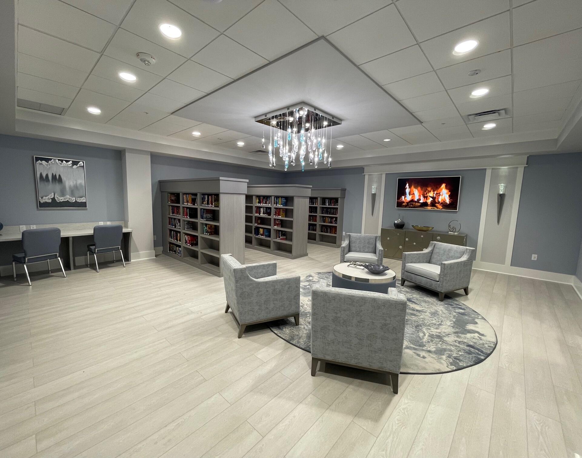 6141 Sunny Pointe Circle, Unit B Delray Beach, FL 33484 - Photo 35 of 62 a living room with furniture and a chandelier