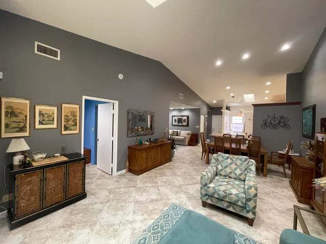 a living room with furniture window and a wooden floor