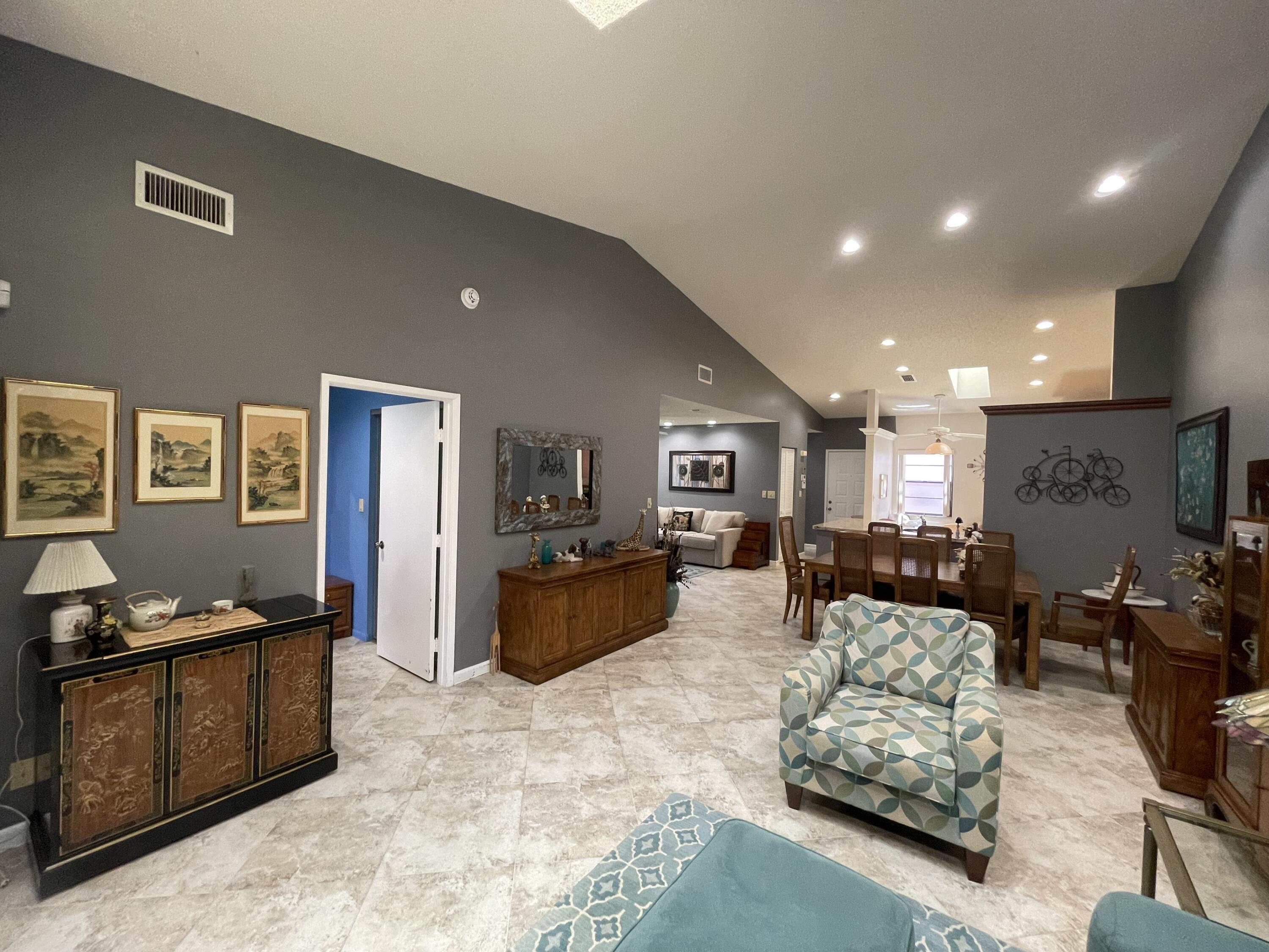 6141 Sunny Pointe Circle, Unit B Delray Beach, FL 33484 - Photo 4 of 62 a living room with furniture window and a wooden floor
