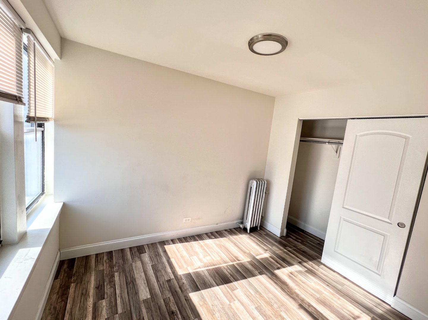 3933 North Clarendon Avenue, Unit 411 Chicago, IL 60613 - Photo 9 of 12 a view of wooden floor in a room