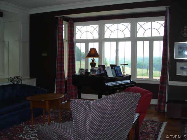 3812 Old Gun Road West Midlothian, VA 23113 - Photo 7 of 10 a bedroom with a bed and wooden floor