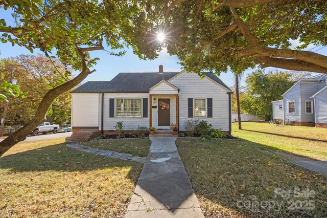 a front view of a house with a yard and porch