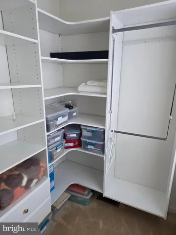 a white toilet sitting next to a bathroom sink and a shower