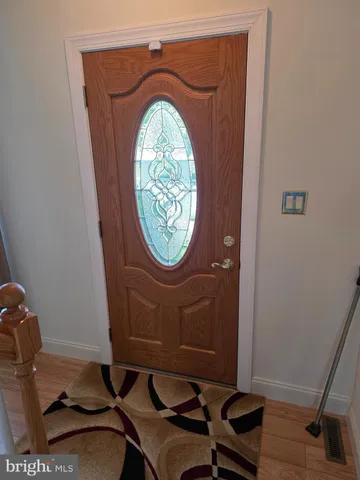 a room with a table and a mirror