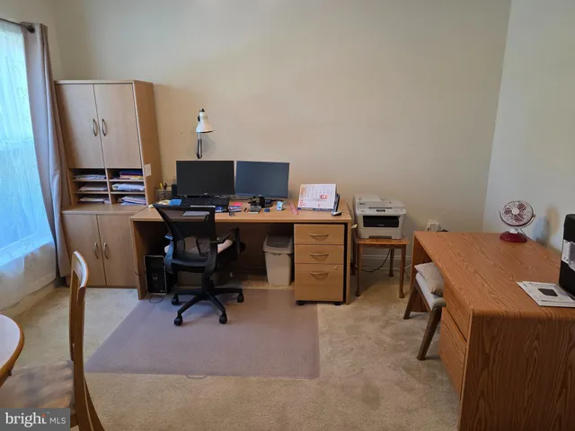 a view of a workspace with furniture