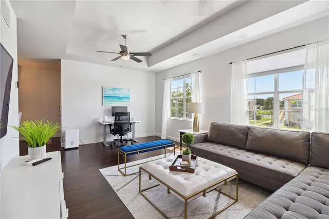 a living room with furniture and a large window