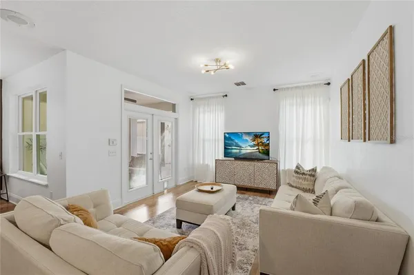 a kitchen with kitchen island granite countertop wooden cabinets and stainless steel appliances