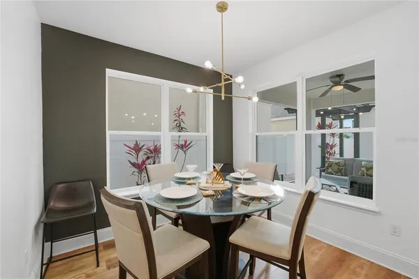 a kitchen with stainless steel appliances granite countertop a refrigerator a stove top oven and a sink with granite countertops